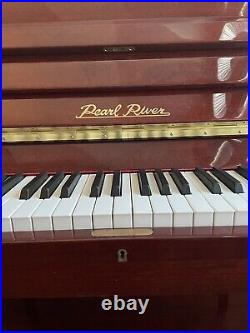2005 Pearl River Upright Piano With Bench. One Owner. Mahogany Finish