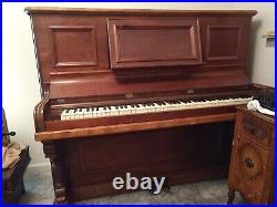 Antique mahoganypiano upright, beautiful wood carving, center section pulls out