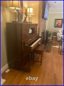 Antique player piano upright