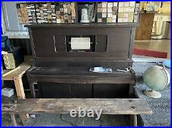 Antique upright player piano