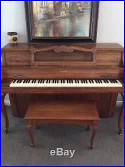 Badlwin Upright Piano with bench Walnut color in great condition. One owner