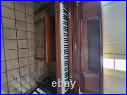 Baldwin upright piano, walnut color, good condition, local pick-up
