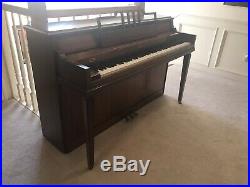 Baldwin upright piano with bench