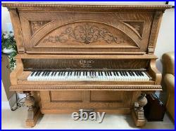 Beautifully Oak Carved Antique Ellington Upright Piano manufactured in 1905