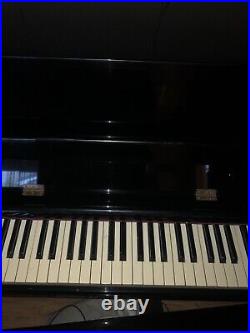 Ebony upright piano used