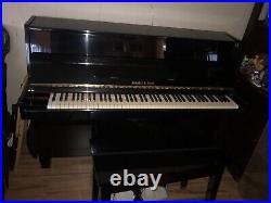 Ebony upright piano used