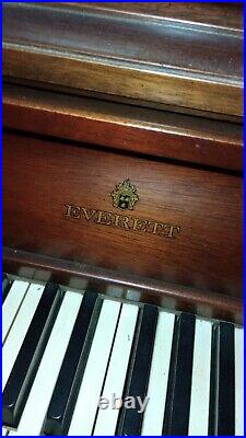 Everett piano and bench. Brown polished finish. About 40 years old
