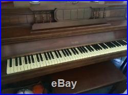 Everett upright brown piano in Saginaw Michigan