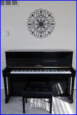Immaculate, black upright Kawai piano