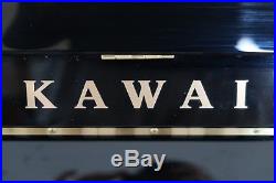 Immaculate, black upright Kawai piano