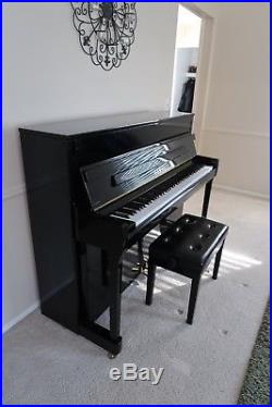 Immaculate, black upright Kawai piano
