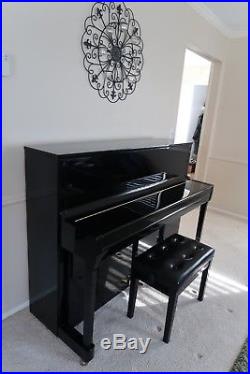 Immaculate, black upright Kawai piano