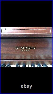 Kimball upright piano including bench and sheet music