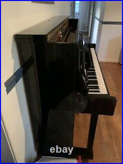 Pearl River Grandstand Piano. Black. Good condition