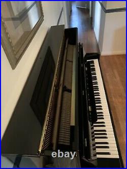 Pearl River Grandstand Piano. Black. Good condition