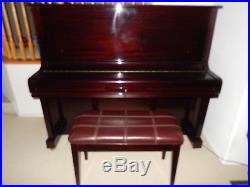 Piano. Schafer & Sons Upright. Rosewood Glossy finish. Slightly used