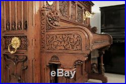Renaissance style, Gebruder Knake upright piano with an ornately carved, oak cas