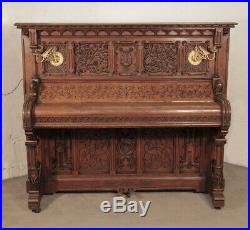 Renaissance style, Gebruder Knake upright piano with an ornately carved oak case