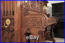 Renaissance style, Gebruder Knake upright piano with an ornately carved oak case