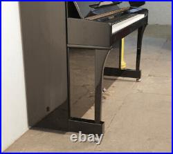Steinmayer Upright Piano For Sale with a Black Case and Brass Fittings