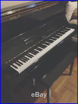 This is a 2002 Boston Upright Piano, Model UP-118E