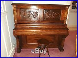Upright Victorian Piano With Dragons Carved on the Front