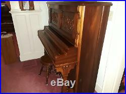 Upright Victorian Piano With Dragons Carved on the Front