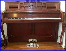 Upright cherrywood Samick piano in excellent condition, 2004. Tuned regularly