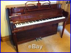 Upright, medium brown, mohogany piano