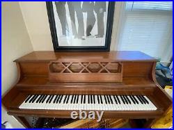 Used wood upright piano. Some scratches. No bench included