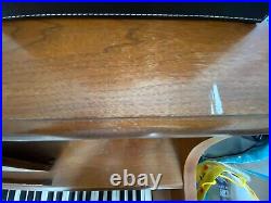Used wood upright piano. Some scratches. No bench included