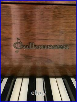 Vintage Gulbransen Brown Upright Piano on Wheels with Ornate Music Desk