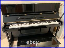 Yamaha upright piano, black in perfect condition